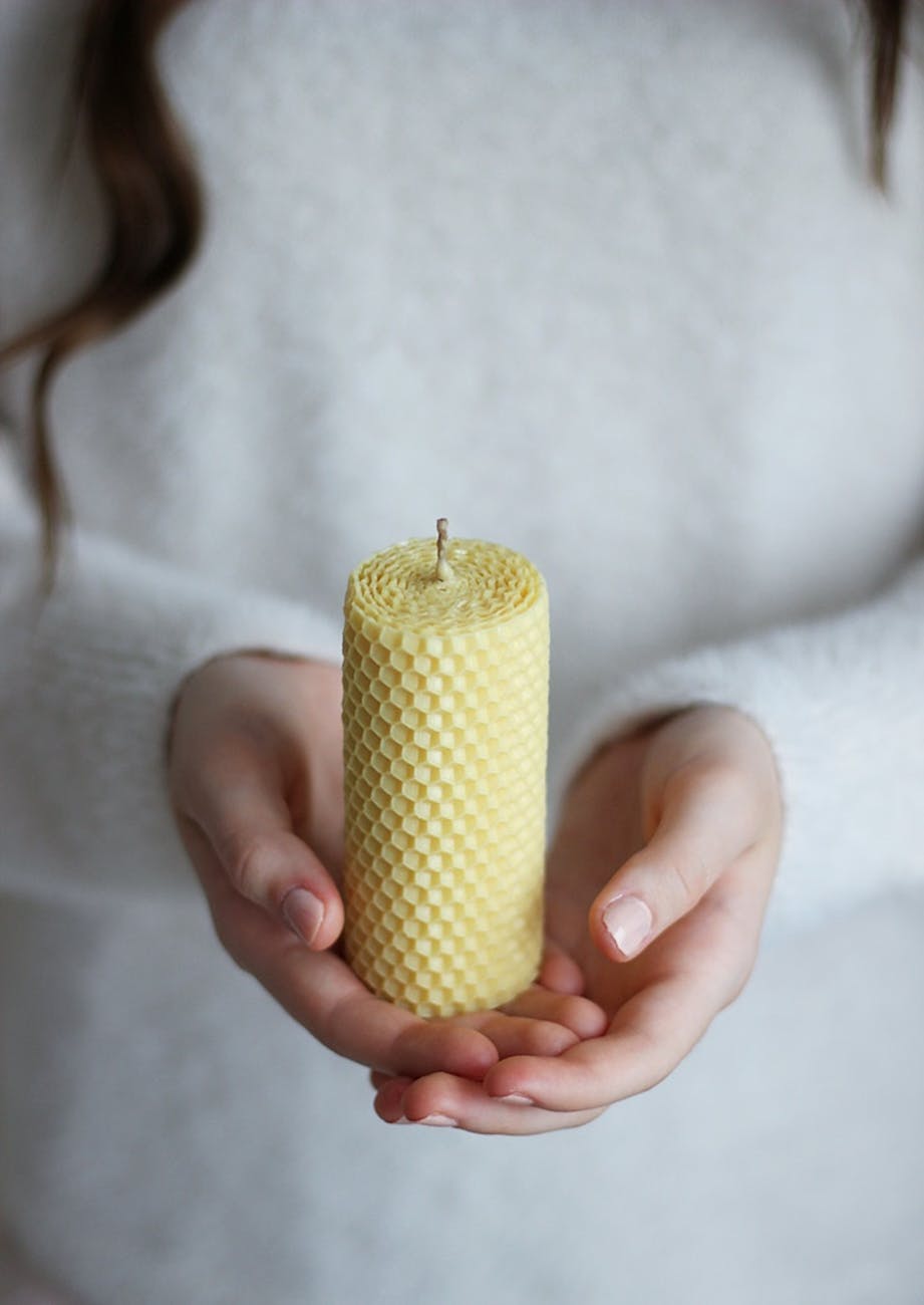 a person holding a candle