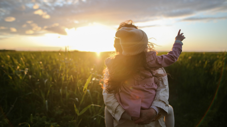 mom holding her daughter looking relieved from anxiety