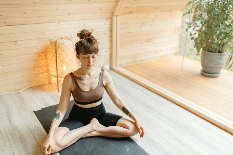 woman in activewear meditating
