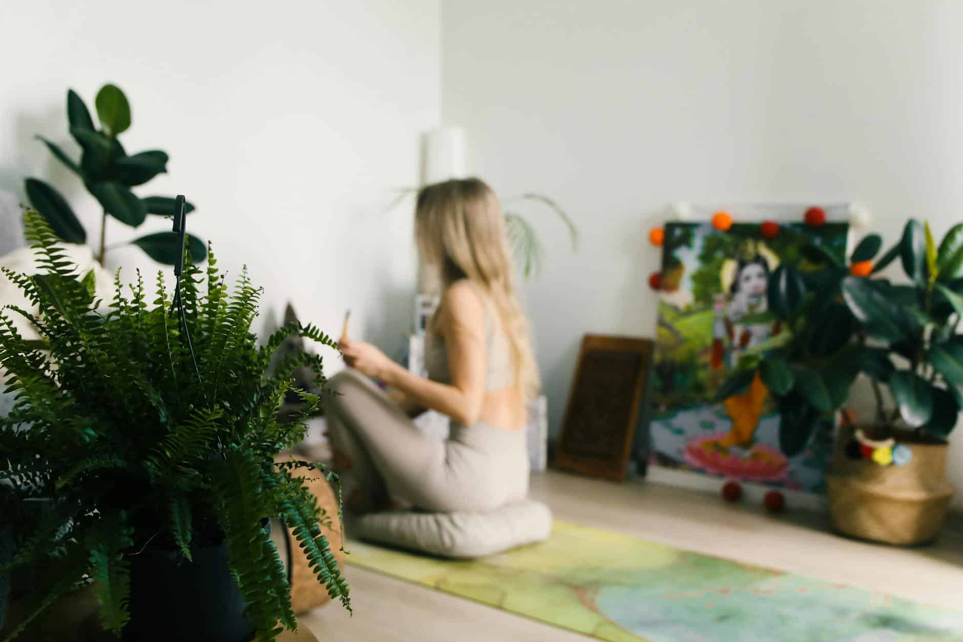 woman sitting in front of an altar doing a ritual