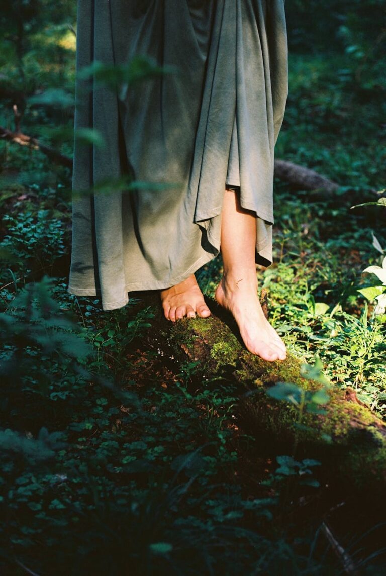 standing barefoot on branch