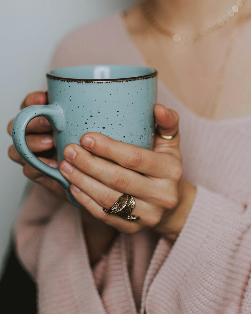 person holding a mug