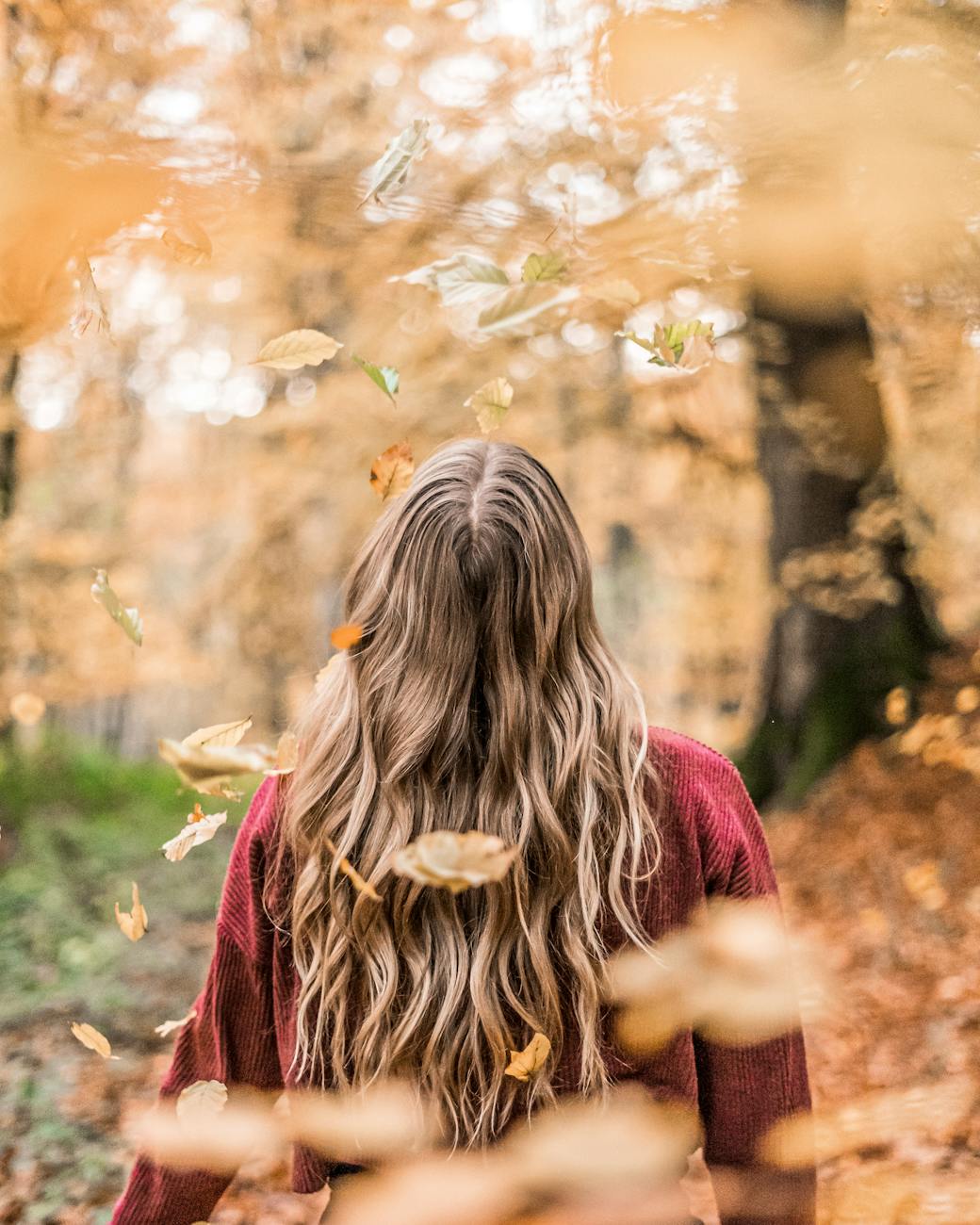 photo of woman wearing red sweater