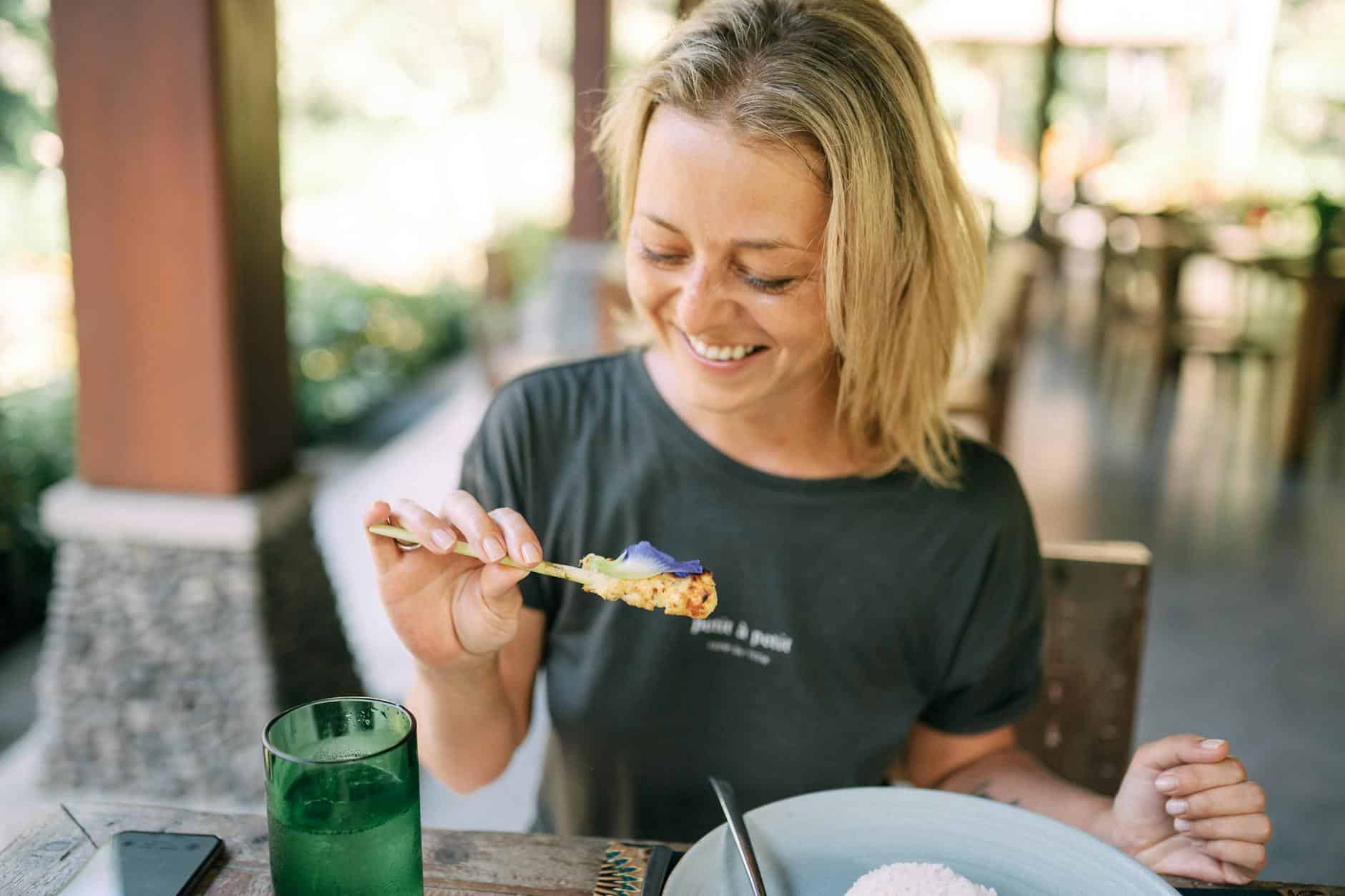 woman eating lunch in restaurant