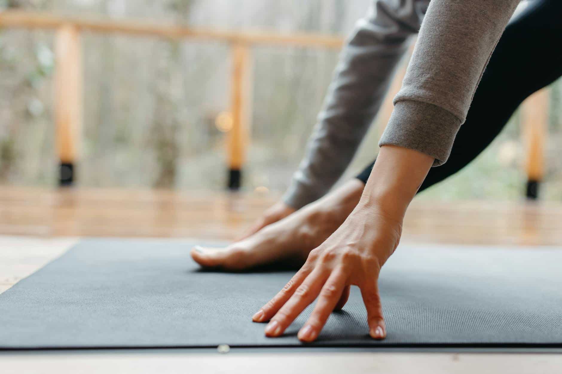 person exercising on yoga mat