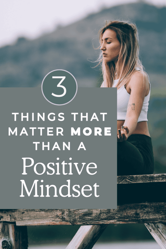 Woman journaling with a positive mindset using a somatic exercise habit tracker