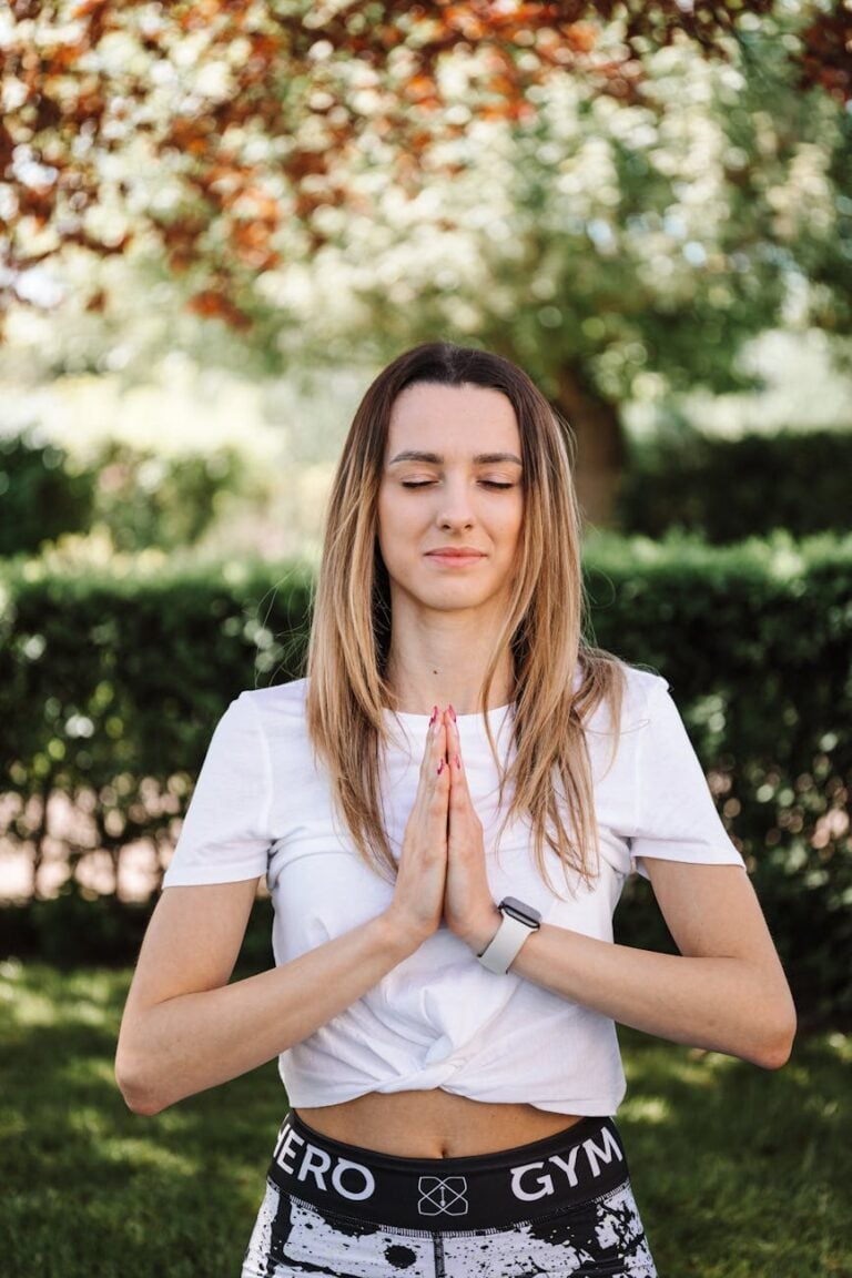 woman in white shirt doing yoga