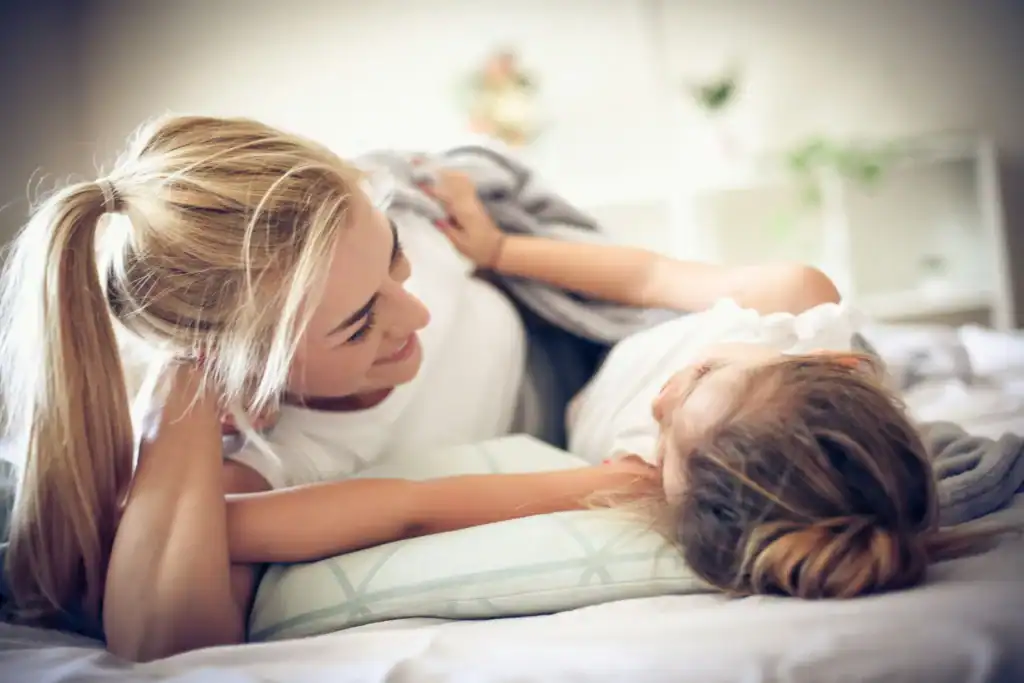 Mom and daughter enjoying a peaceful morning together at home.
