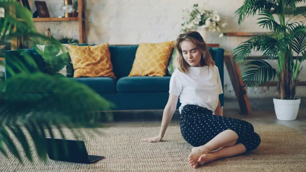 A woman practicing morning mindfulness and self-care at home for overwhelmed moms.